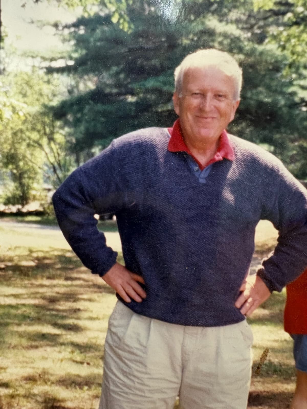 Dr. Peter Van Orman standing outdoors, smiling, with his hands on his hips