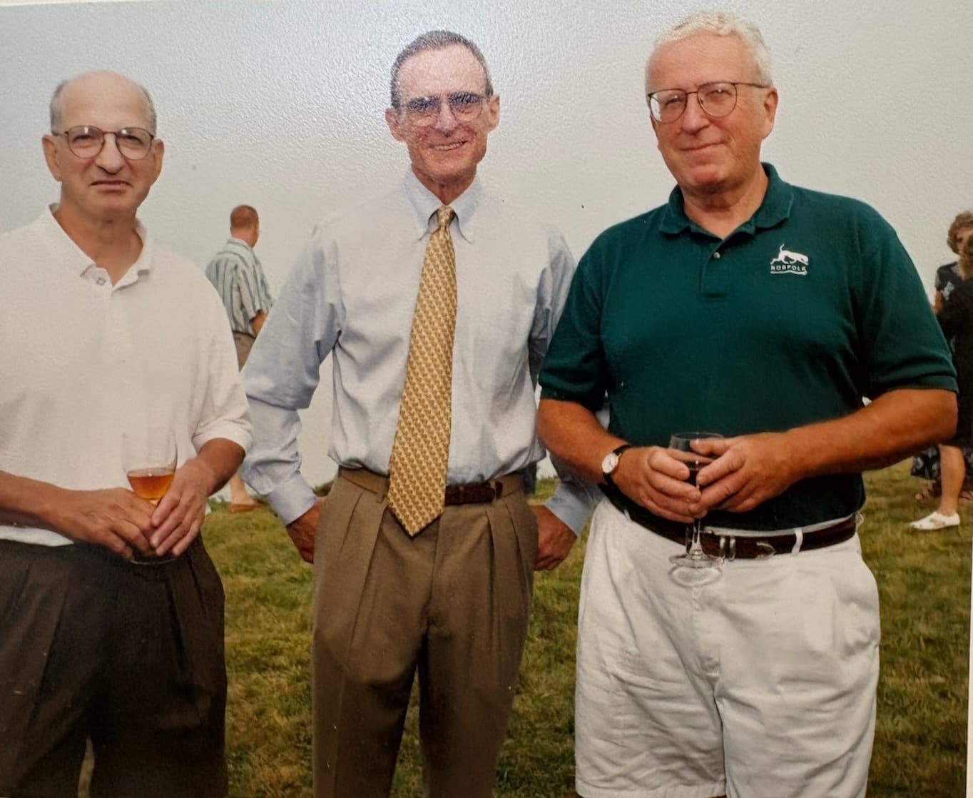 Dr. Peter Van Orman, right, standing outdoors with two friends